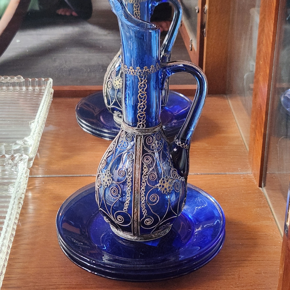 mid-century decorative cobalt blue glass ewer with hand-applied brass filigree,